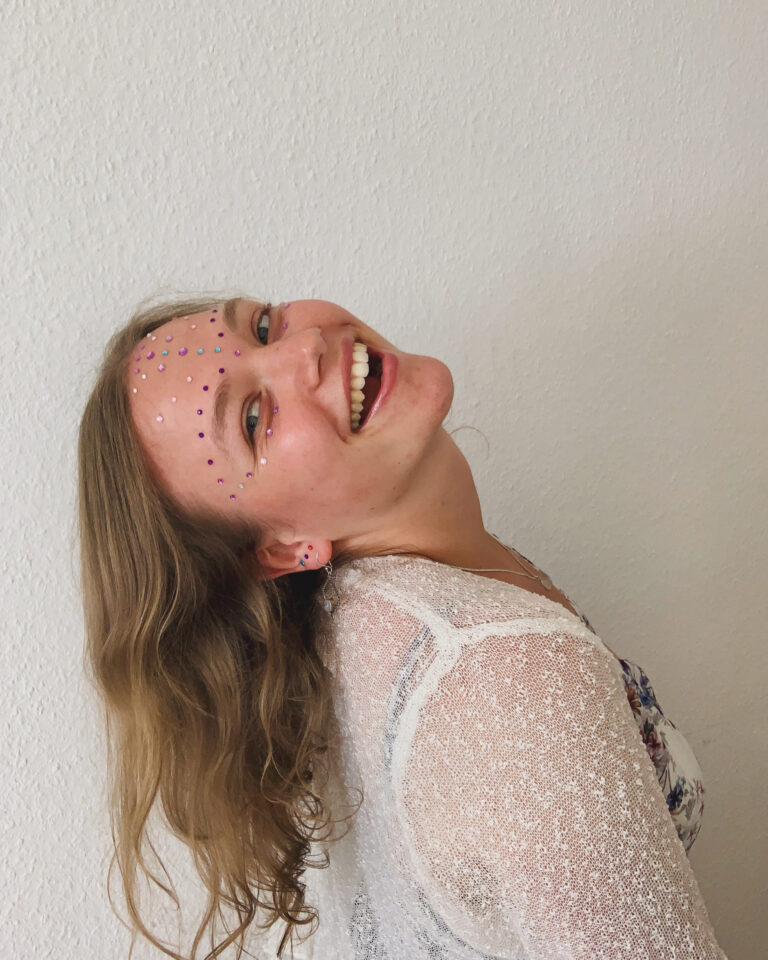 Marieyella laughing with her head back